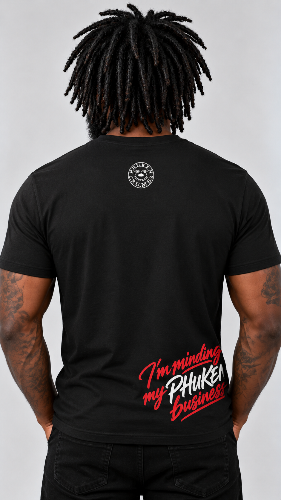 Back view of the black PHUKEN business T-shirt on a model